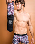 Eco-friendly boxer briefs featuring painted Protea flora against a stylish burgundy background