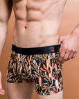 Men's bamboo underwear in black with Grass Tree design featuring tones of burnt orange and sage green