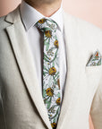 Chic Banksia Grey tie made from 100% cotton, showcasing detailed native Australian flora in soft green and yellow on a grey background