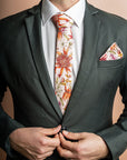 100% cotton tie showcasing an array of colorful native flowers, blending nature-inspired beauty with fashionable design