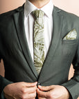 Chic cotton tie in sage with a detailed fan palm leaf pattern, perfect for adding a touch of the tropics to formal wear