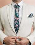 Cotton tie with a striking botanical print, combining detailed foliage and plant motifs for a unique and elegant look