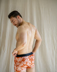 Eco-friendly, comfortable men's underwear in burnt orange with distinctive white floral outlines