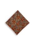 Stylish 100% cotton pocket square with a flowering gum design in terracotta, perfect for adding a pop of natural color and sophistication to any suit