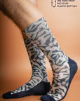 Recycled polyester socks adorned with Australian Flowering Gum, blending pink floral patterns with a serene blue base