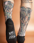 Recycled polyester socks in black, adorned with Australian Grass Tree illustrations, symbolizing growth and survival in harsh conditions