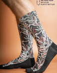 Recycled polyester socks showcasing a stylish Protea print in forest green, blending comfort with environmental responsibility