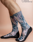 Recycled polyester socks showcasing a lush floral design on a teal base, perfect for adding a pop of color and environmental consciousness to any outfit