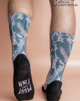 Eco-friendly socks with a Teal Blooms print, featuring sea foam, rose pink, white, peach, and baby pink hand-painted blooms, inspired by ocean colors