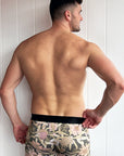 Comfortable bamboo underwear with a botanical print inspired by Australian native flowers on a dark background