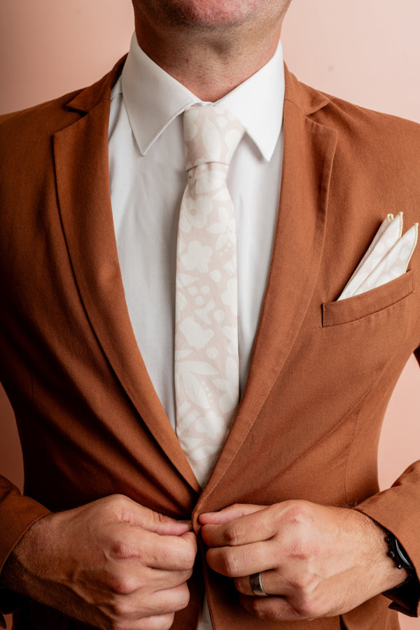 Elegant cotton tie featuring a minimalist cut-out flower design in abstract form, perfect for adding a modern touch to formal wear