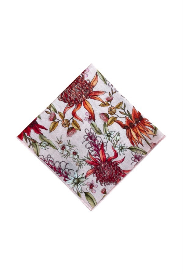 Botanical-themed pocket square with vibrant prints of native flowers in pink, red, green, white, and orange, offering a statement piece for any upscale occasion