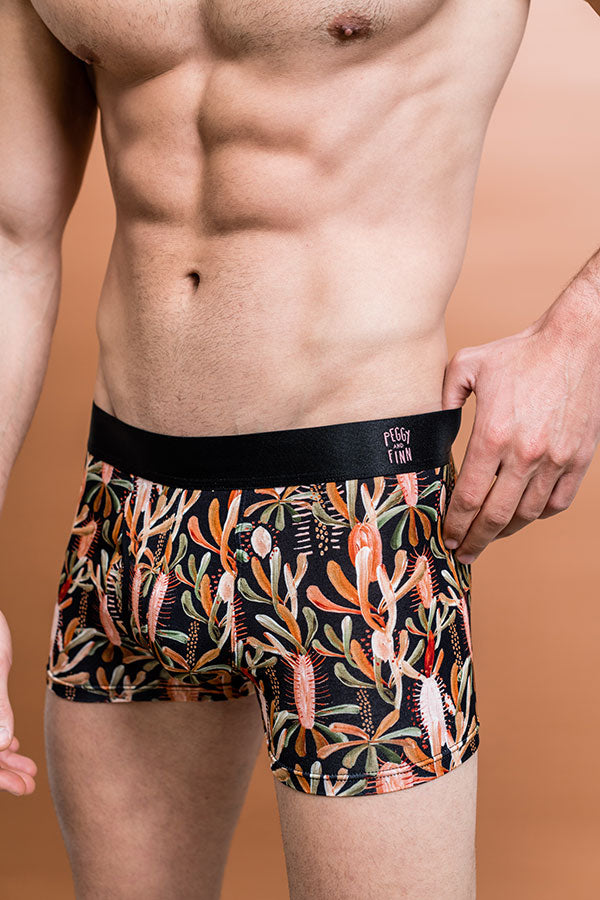 Men's bamboo underwear in black with Grass Tree design featuring tones of burnt orange and sage green