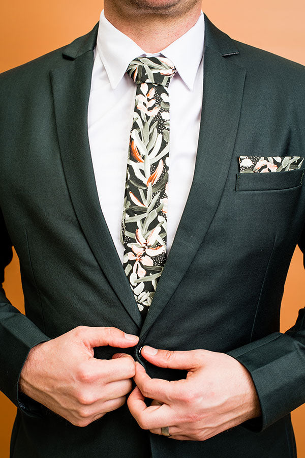 Stylish cotton tie showcasing a vibrant protea design in green, ideal for formal occasions and nature lovers