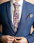 Navy cotton tie featuring an intricate protea floral print, showcasing the detailed petals and foliage of this stunning flower