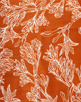 Intricate kangaroo paw floral print in burnt orange with delicate details and vibrant hues, showcasing Australian native flora