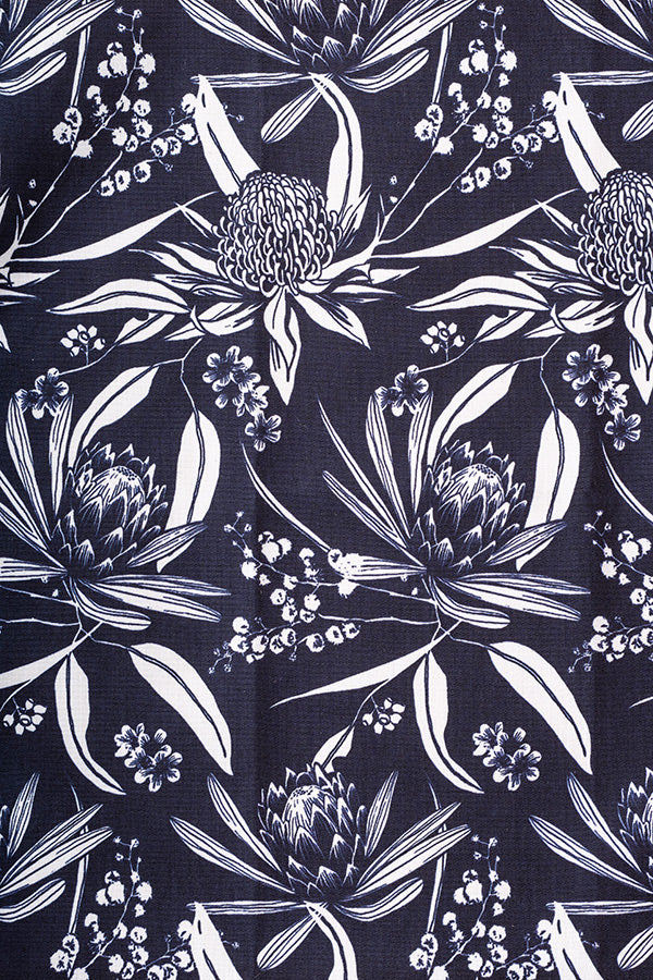 Simple navy and white print depicting Australian native flora, elegantly contrasted for a classic and refined look