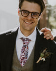 Groom in the stylish cotton tie showcasing a vibrant protea design in burgundy, ideal for formal occasions and nature lovers