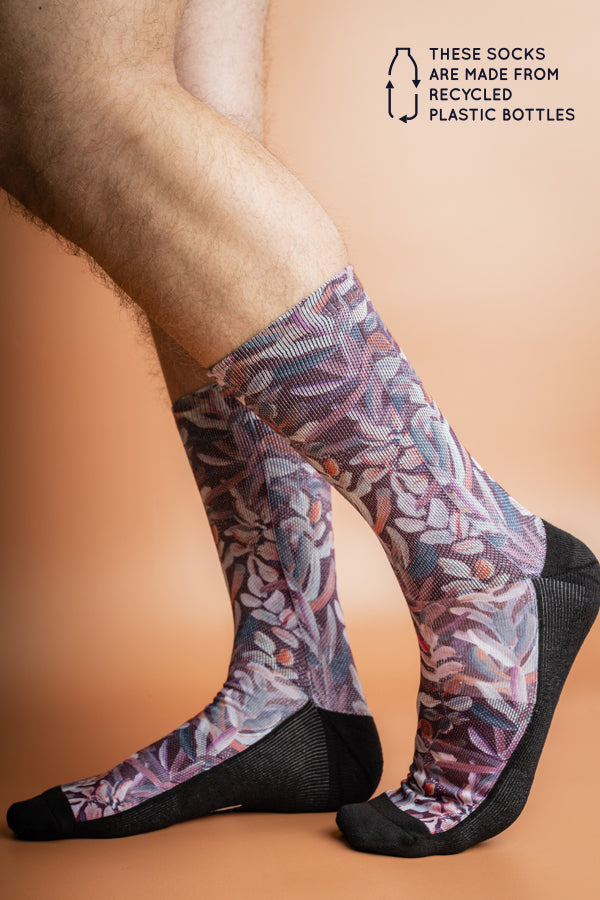 Soft and durable socks crafted from recycled bottles, decorated with a lush Protea flower pattern in warm burgundy tones, ideal for everyday wear