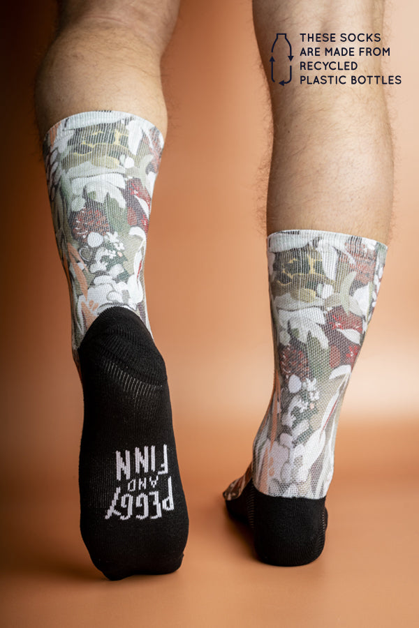 Sustainable socks made from recycled materials, showcasing detailed patterns of Spotted Gum bark and leaves in natural Australian colors